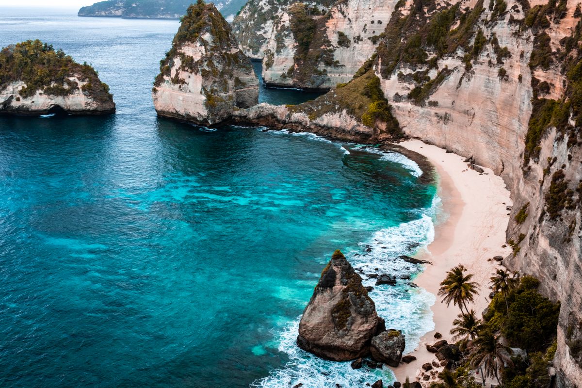 A coastal cove beneath cliffs