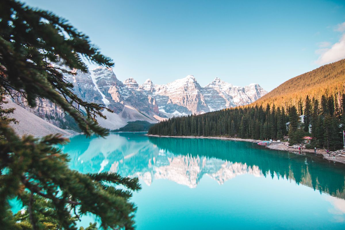 A bright mountain lake surrounded by forest
