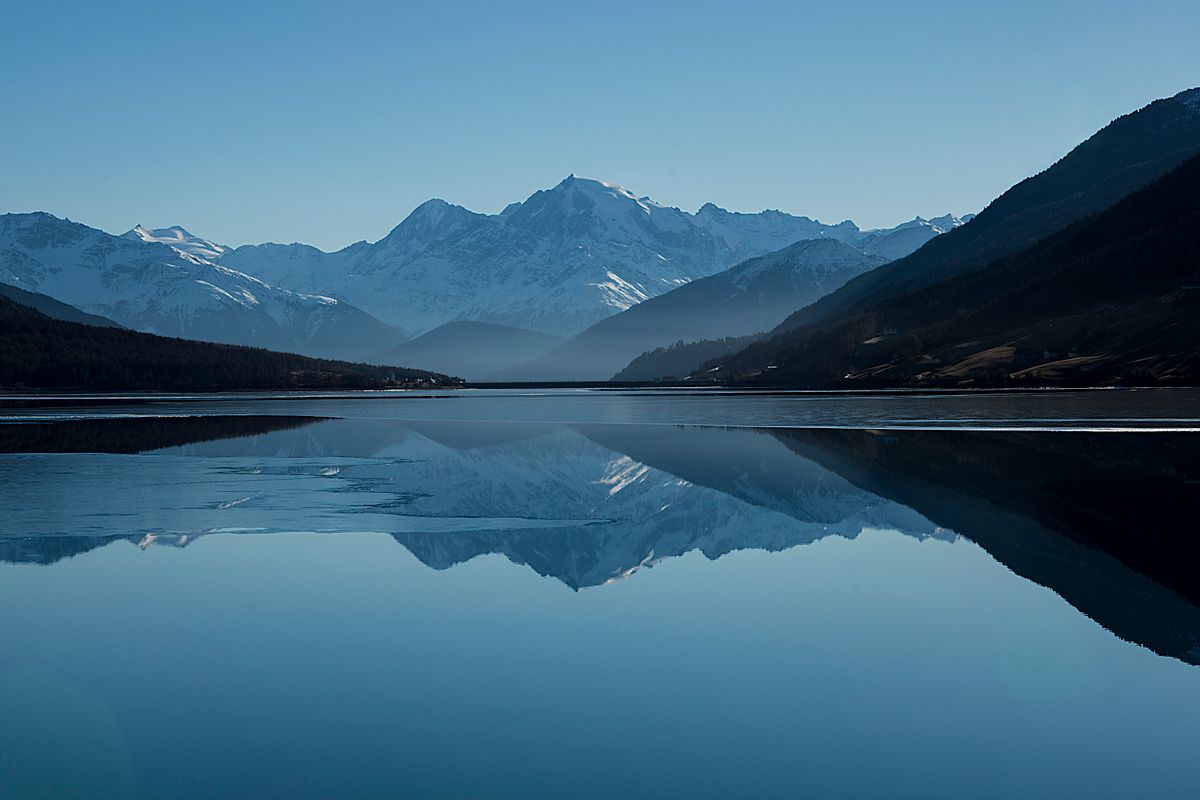 Mountains reflected in a still lake
